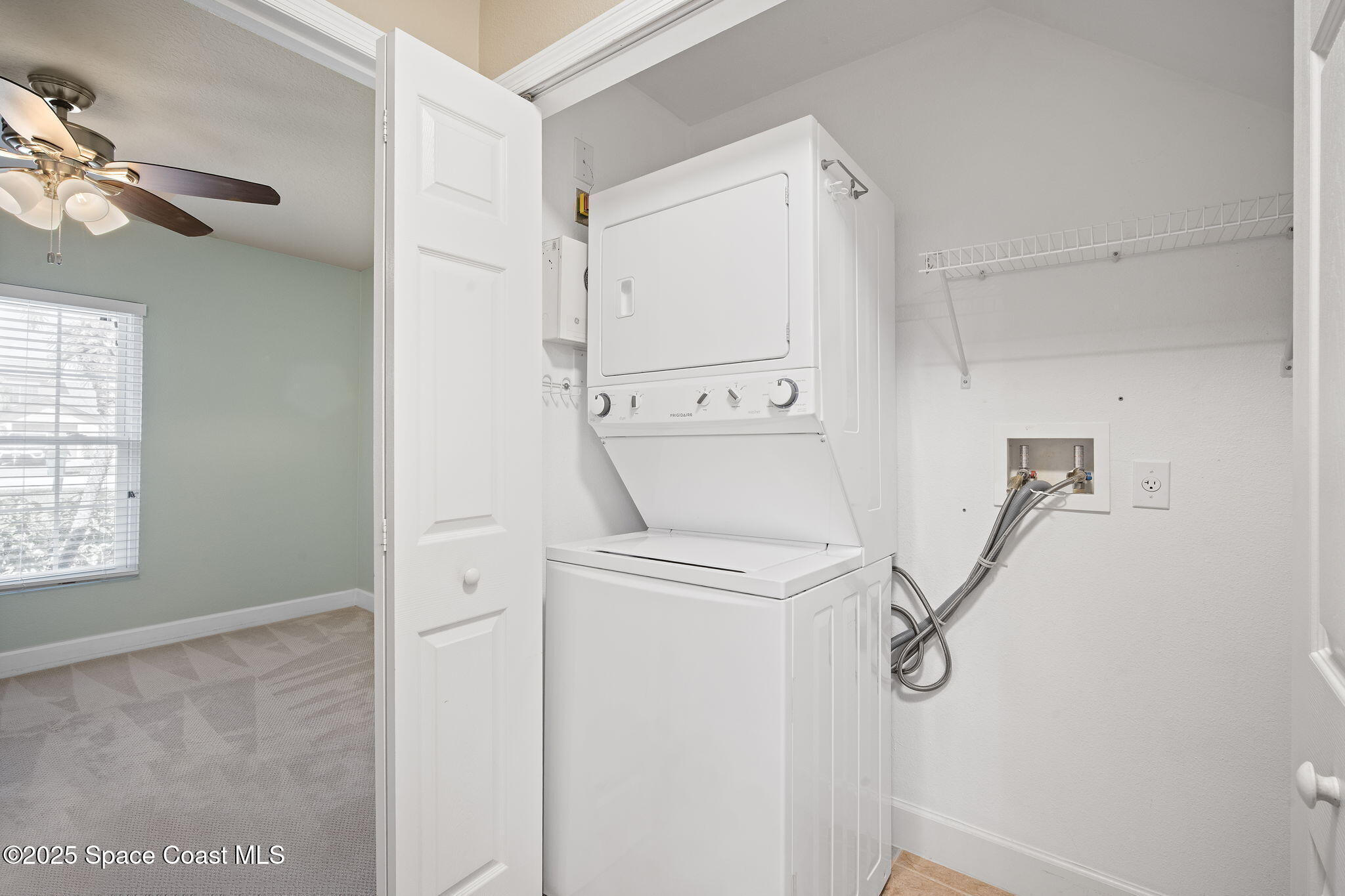 4575 Radiant Way, Unit 102 Melbourne, FL 32901 - Photo 18 of 52 a utility room with dryer and washer
