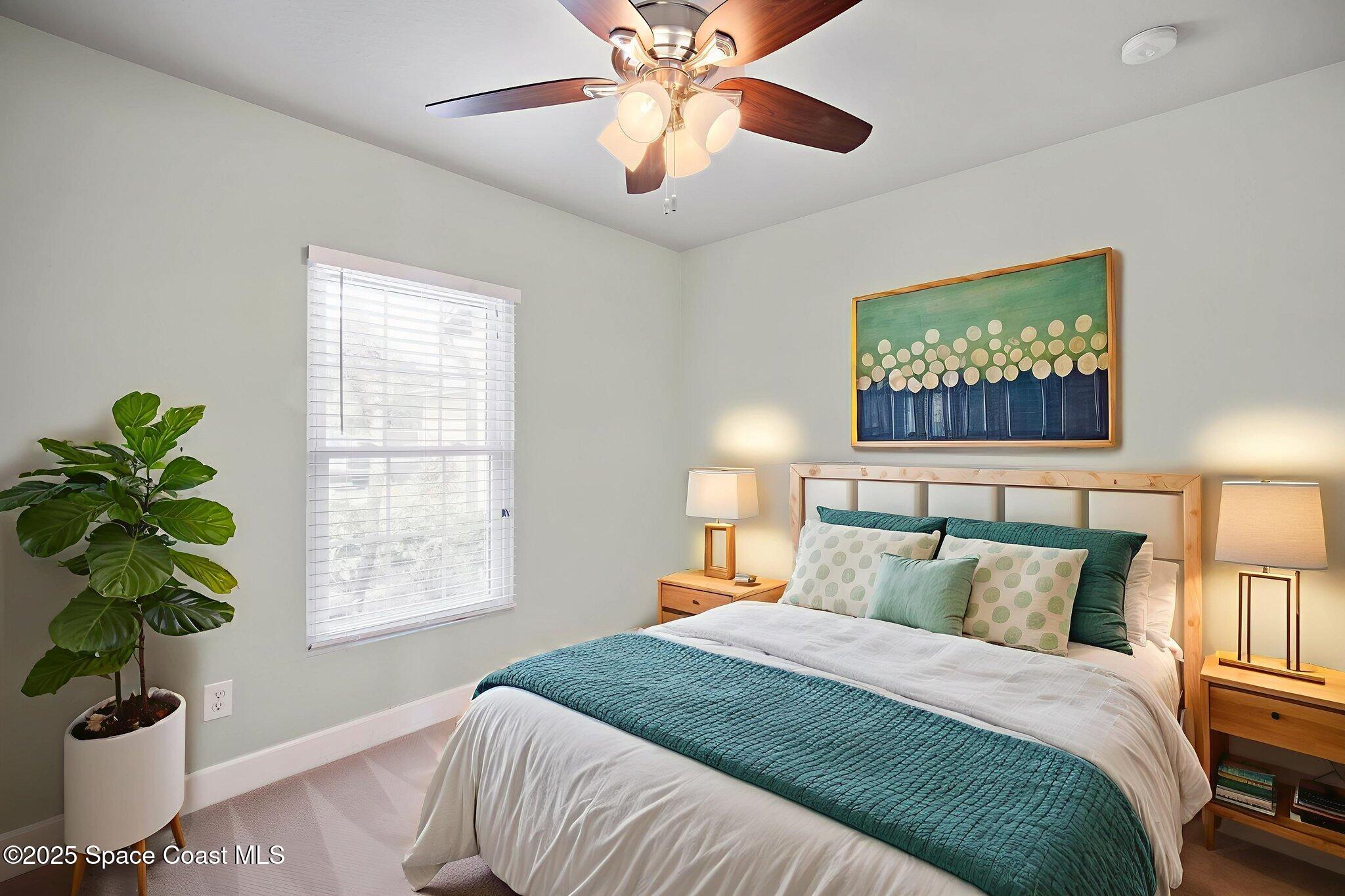 4575 Radiant Way, Unit 102 Melbourne, FL 32901 - Photo 19 of 52 a bedroom with a bed and a window