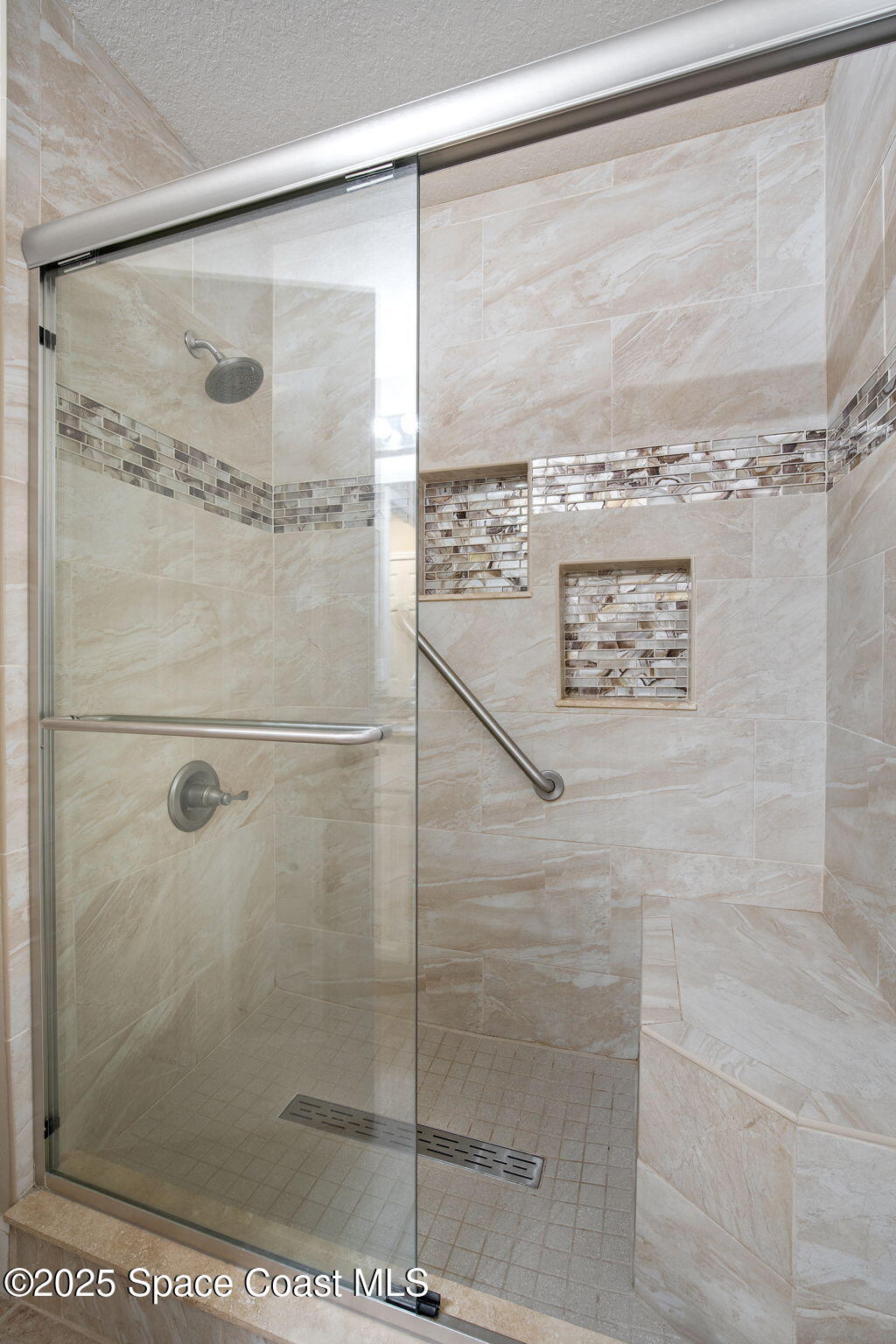 4575 Radiant Way, Unit 102 Melbourne, FL 32901 - Photo 24 of 52 a bathroom with a shower
