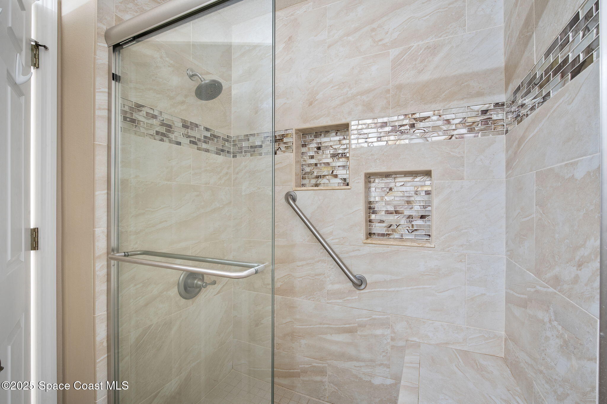 4575 Radiant Way, Unit 102 Melbourne, FL 32901 - Photo 25 of 52 a bathroom with a shower