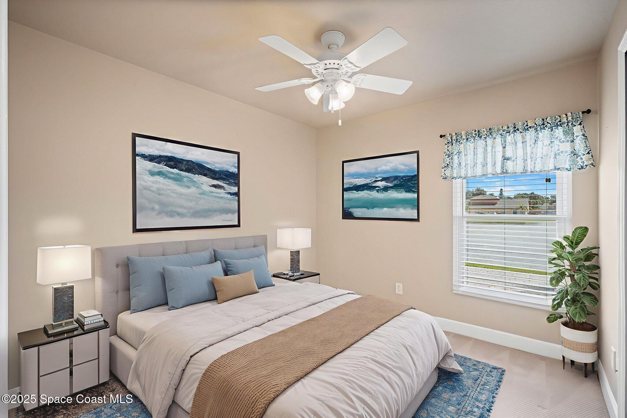4575 Radiant Way, Unit 102 Melbourne, FL 32901 - Photo 27 of 52 a bedroom with a bed and a chandelier