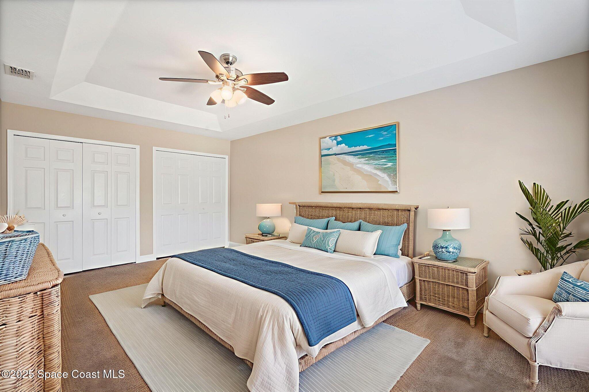 4575 Radiant Way, Unit 102 Melbourne, FL 32901 - Photo 31 of 52 a bedroom with a large bed and a couch