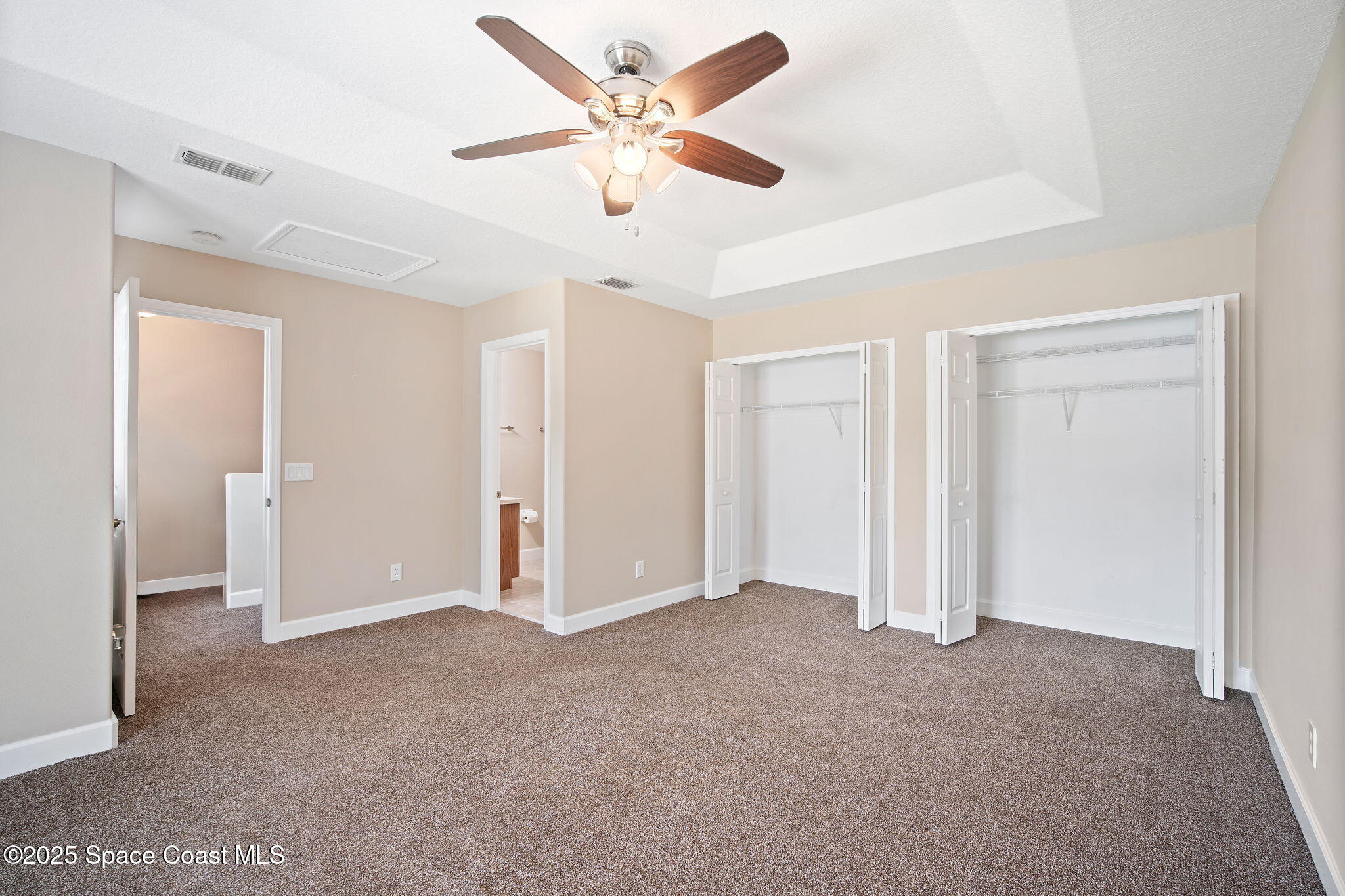 4575 Radiant Way, Unit 102 Melbourne, FL 32901 - Photo 33 of 52 a view of an empty room and a ceiling fan