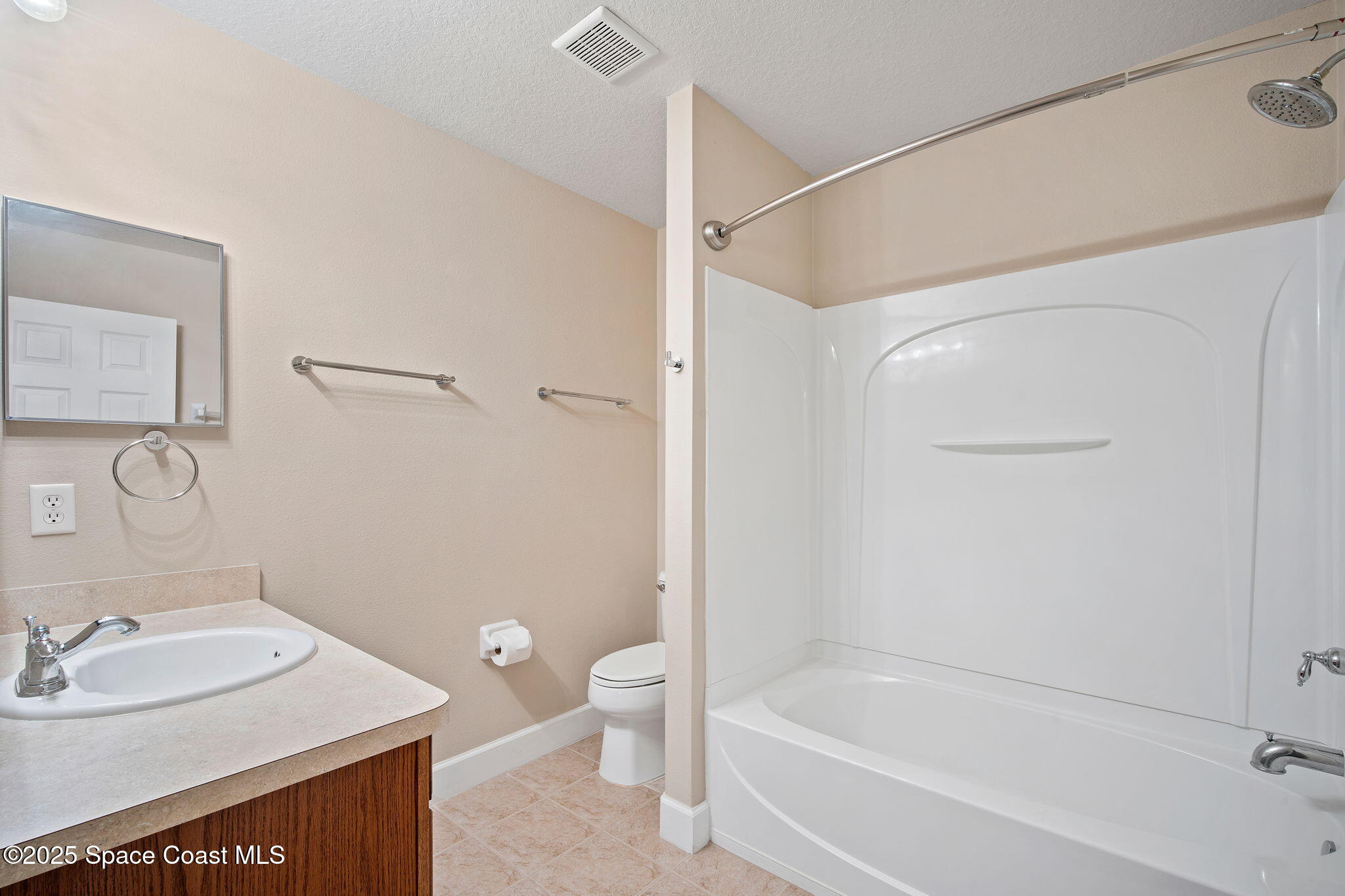 4575 Radiant Way, Unit 102 Melbourne, FL 32901 - Photo 34 of 52 a bathroom with a sink toilet and shower