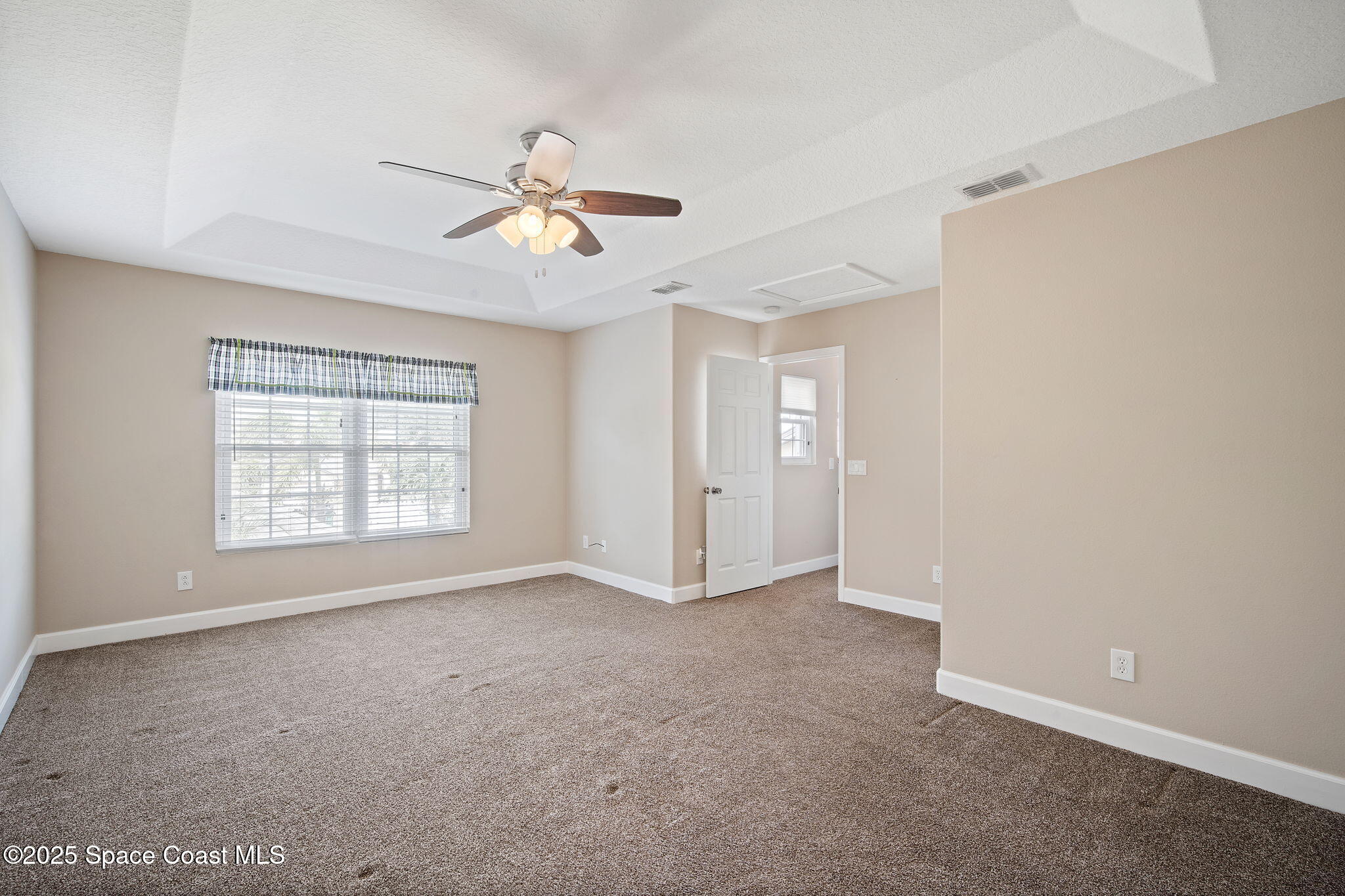 4575 Radiant Way, Unit 102 Melbourne, FL 32901 - Photo 36 of 52 a view of an empty room with a window