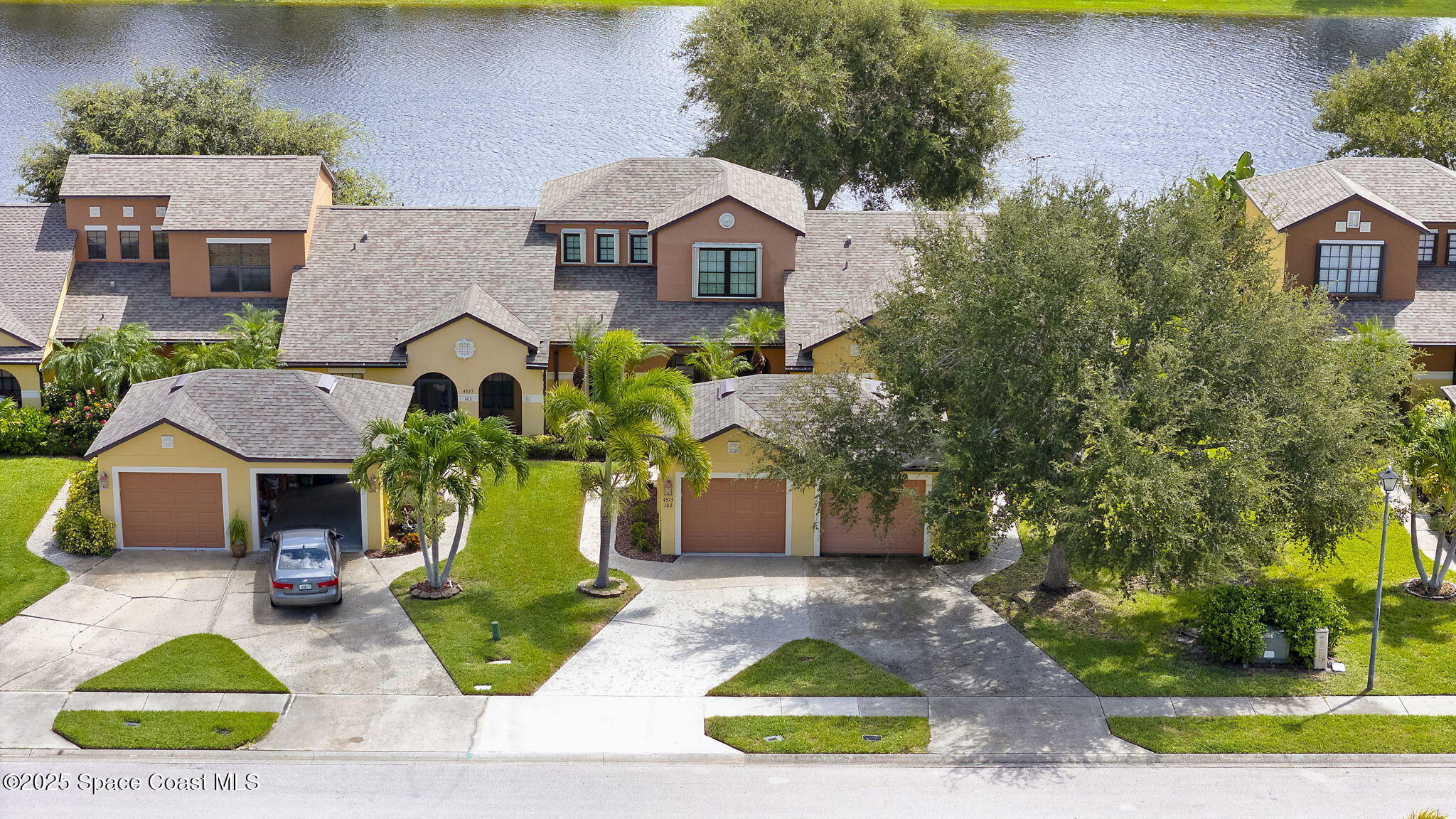 4575 Radiant Way, Unit 102 Melbourne, FL 32901 - Photo 37 of 52 a front view of a house with garden