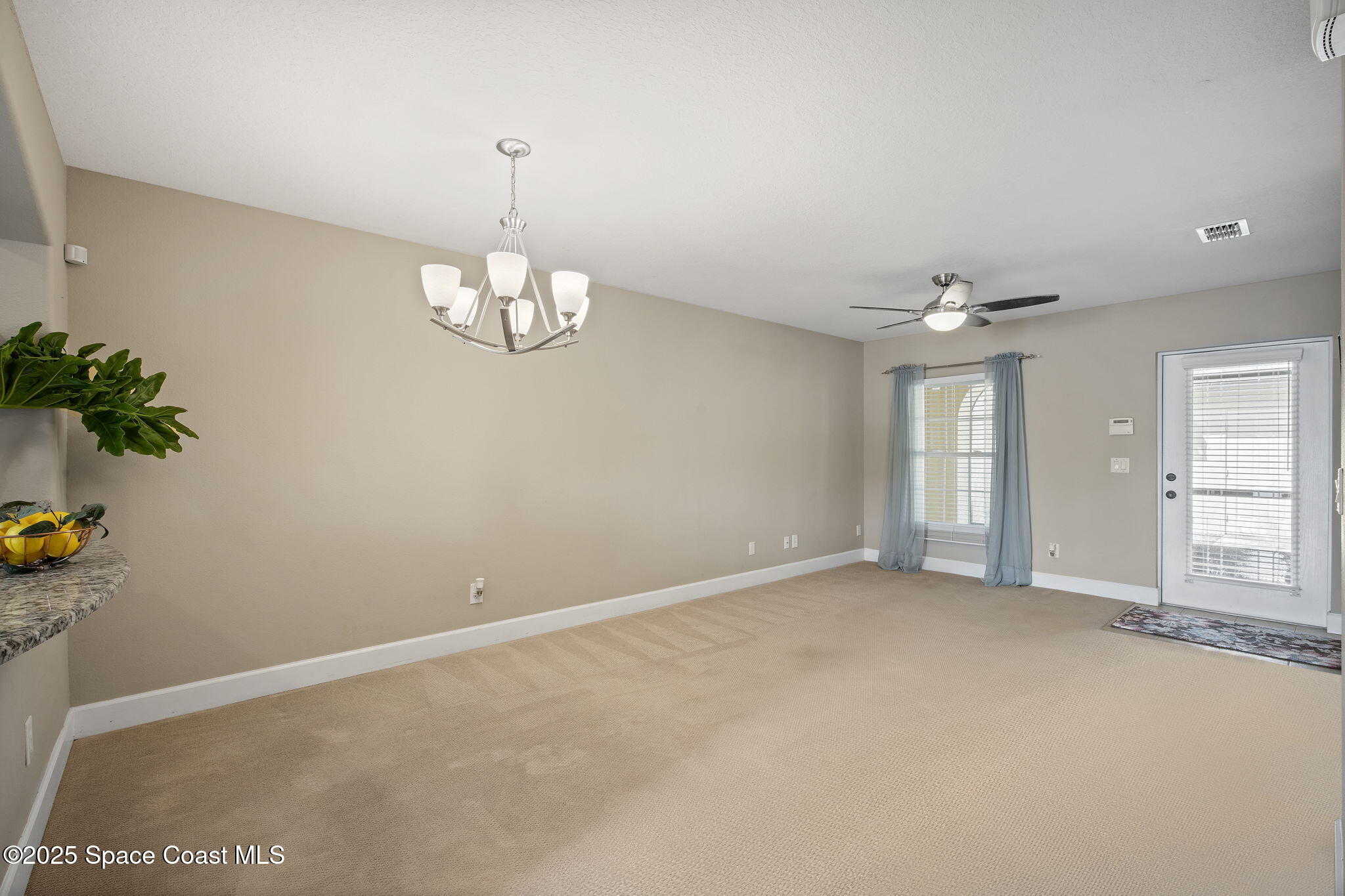 4575 Radiant Way, Unit 102 Melbourne, FL 32901 - Photo 6 of 52 wooden floor in an empty room with a window