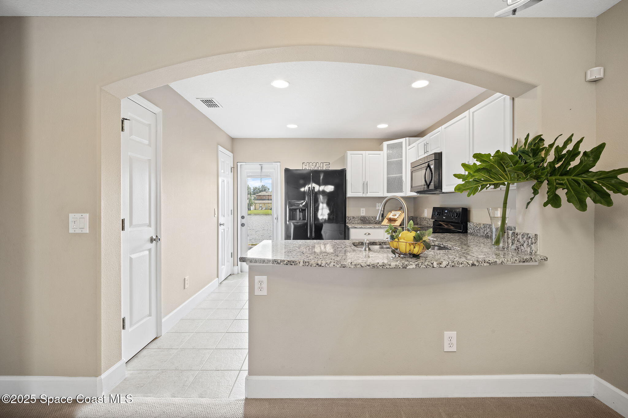 4575 Radiant Way, Unit 102 Melbourne, FL 32901 - Photo 8 of 52 a view of kitchen with refrigerator sink and outdoor living room