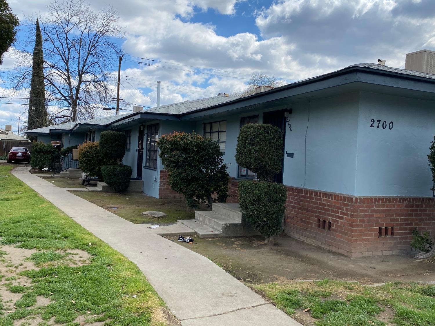2700 North First Street Fresno, CA 93703 - Photo 1 of 2 a front view of a house with garden
