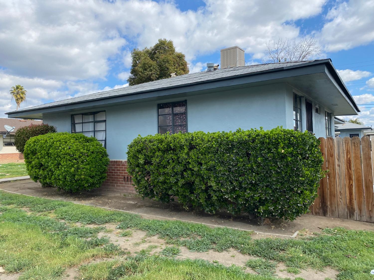 2700 North First Street Fresno, CA 93703 - Photo 2 of 2 a front view of a house with garden