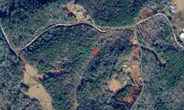 a bathroom with a granite countertop sink and vanity
