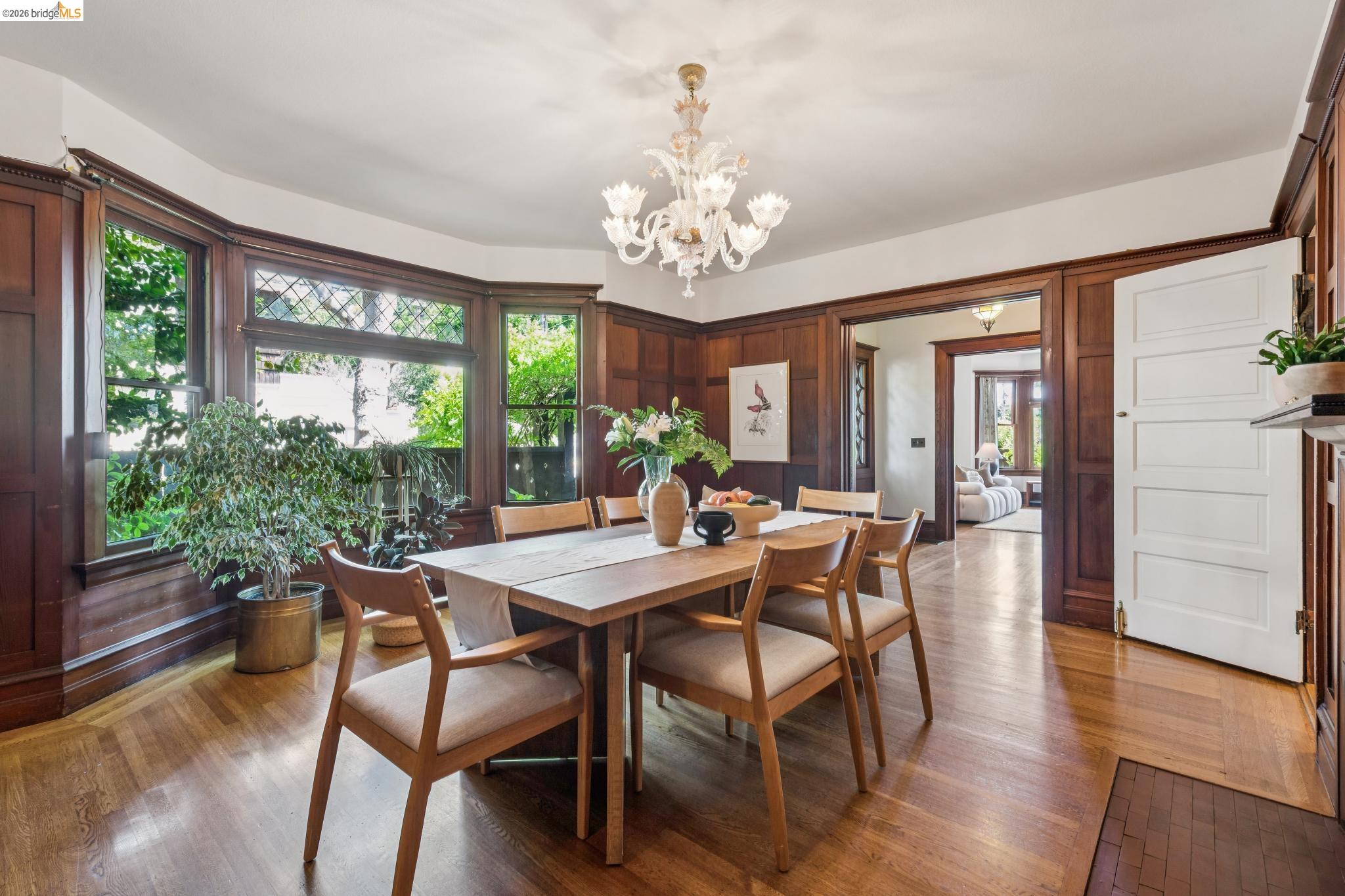 1490 Arch Street Berkeley, CA 94708 - Photo 13 of 57 a view of a dining room with furniture a chandelier and wooden floor