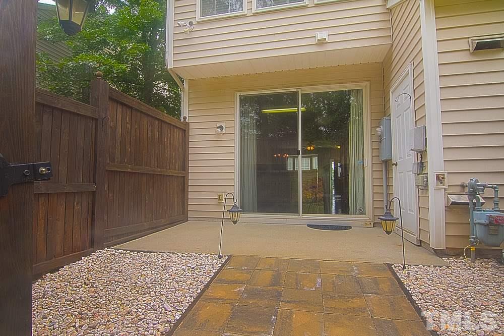 1624 Brook Fern Way Raleigh, NC 27609 - Photo 14 of 15 Fenced in for privacy and outdoor closet for storage.