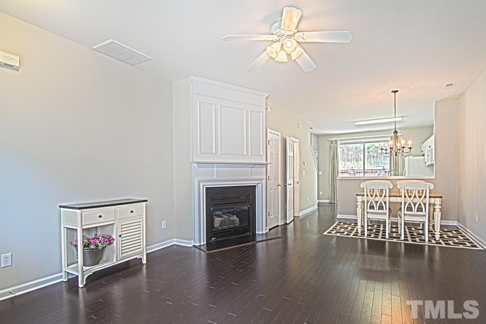 1624 Brook Fern Way Raleigh, NC 27609 - Photo 4 of 15 From the front door, you walk into large living area with a gas log fireplace.