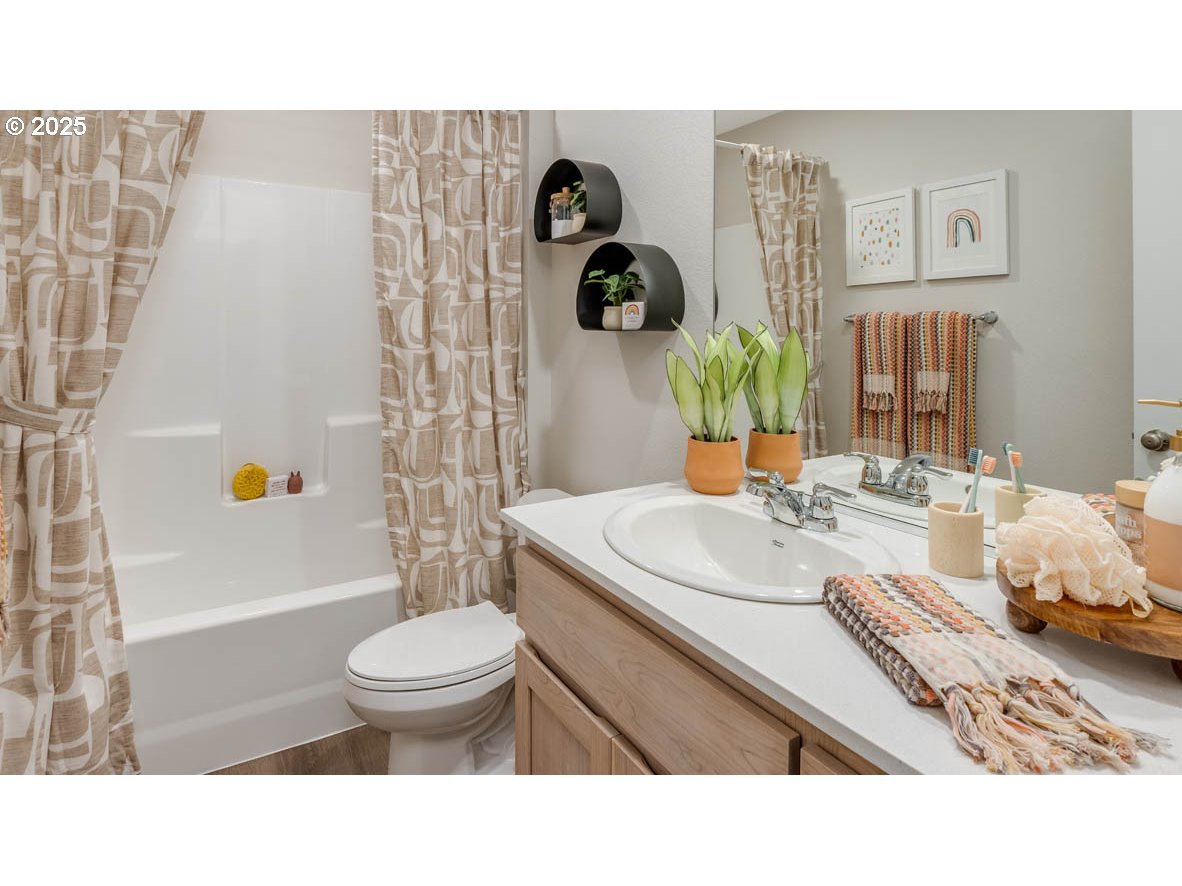 6039 Southeast 15th Street Gresham, OR 97080 - Photo 24 of 34 a bathroom with a sink toilet and shower