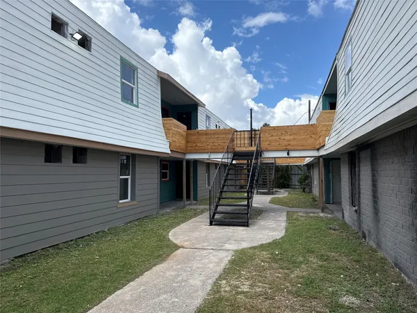a view of a backyard with a small cabin