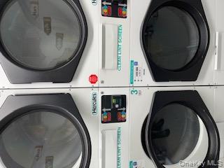 390 Riverside Drive, Unit 12AC Manhattan, NY 10025 - Photo 24 of 29 Laundry area featuring stacked washer / dryer