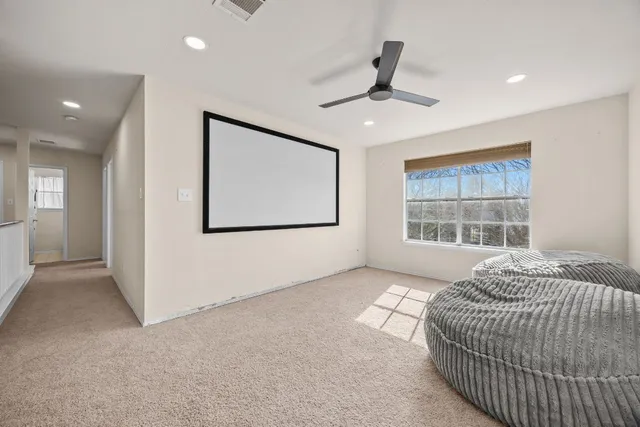 a spacious bedroom with a large bed and a window