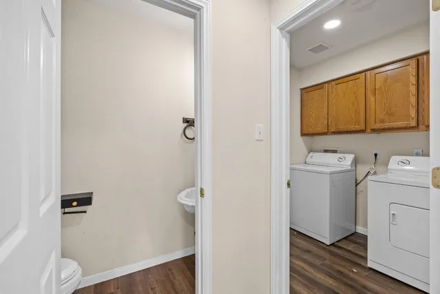 a bathroom with a sink toilet and vanity