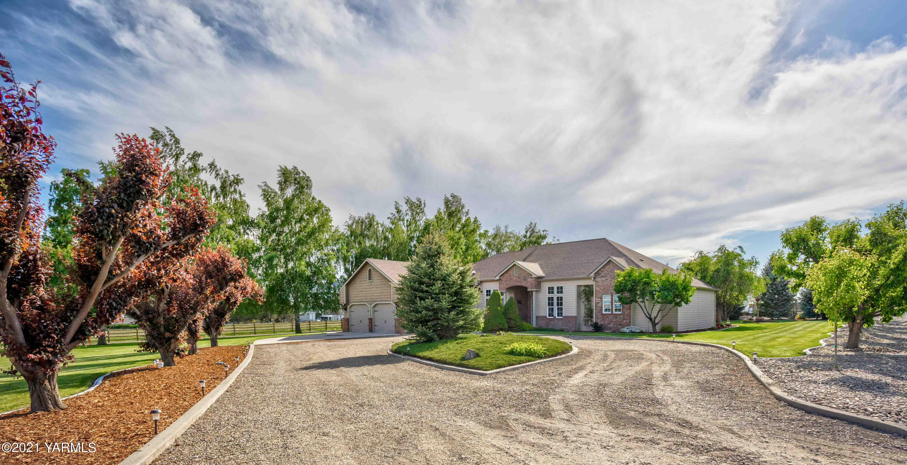 3131 Scoon Road Sunnyside, WA 98944 - Photo 23 of 33 a front view of a house with a yard and trees