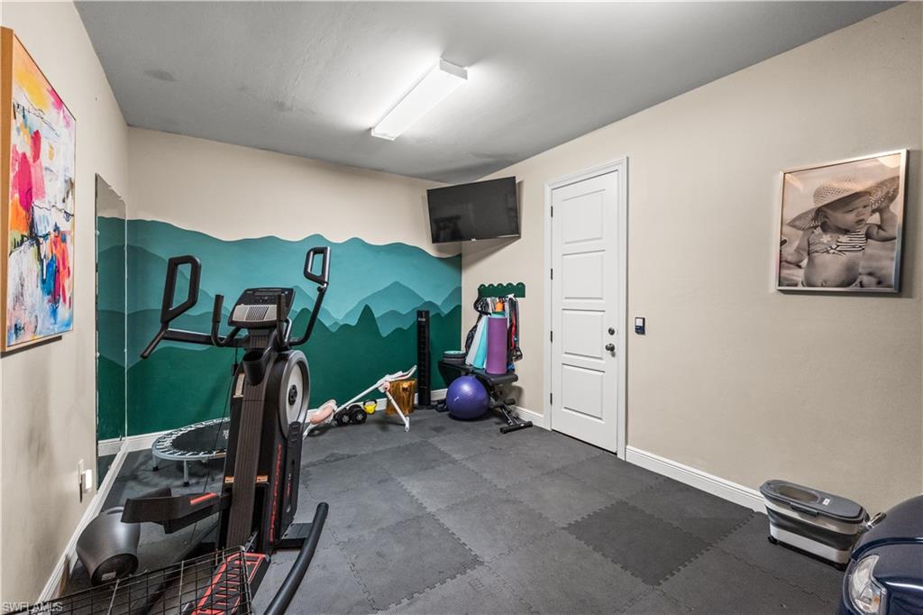 6370 Hunters Road Naples, FL 34109 - Photo 31 of 50 Insulated garage converted to gym