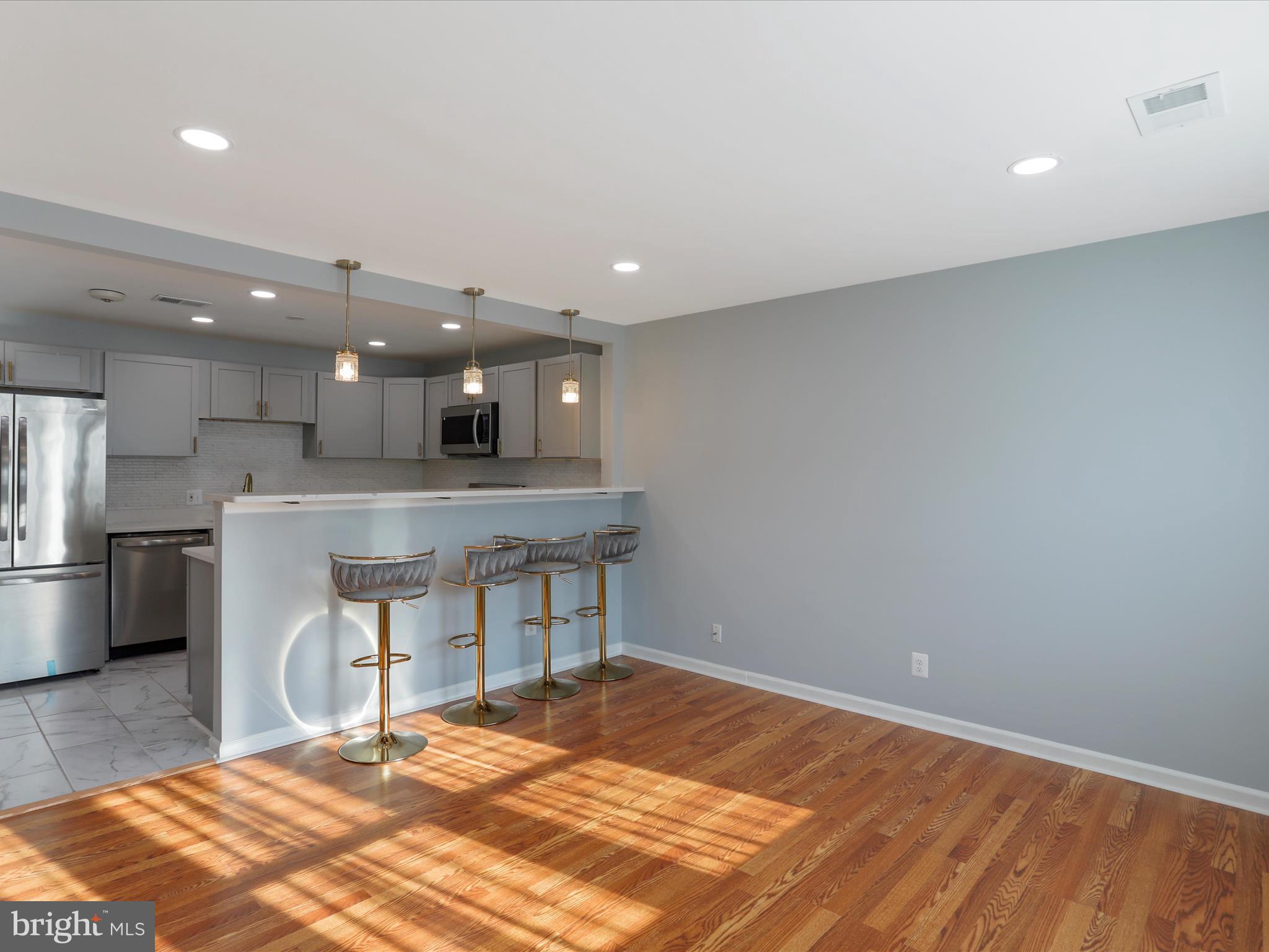8175 Stone Bridge Road Greencastle, PA 17225 - Photo 12 of 44 a kitchen with a refrigerator and a wooden floor