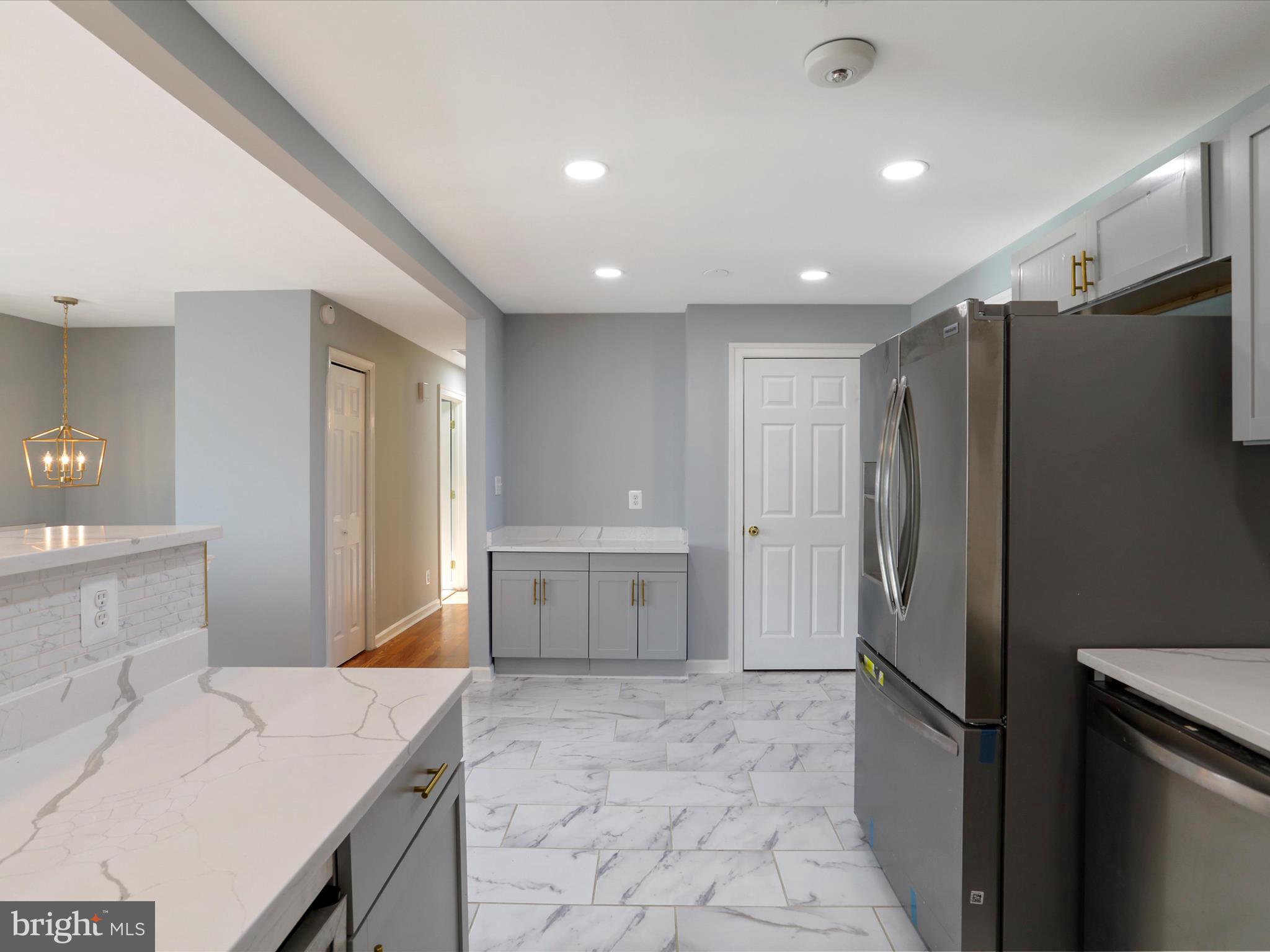 8175 Stone Bridge Road Greencastle, PA 17225 - Photo 13 of 44 a kitchen with a refrigerator and a sink