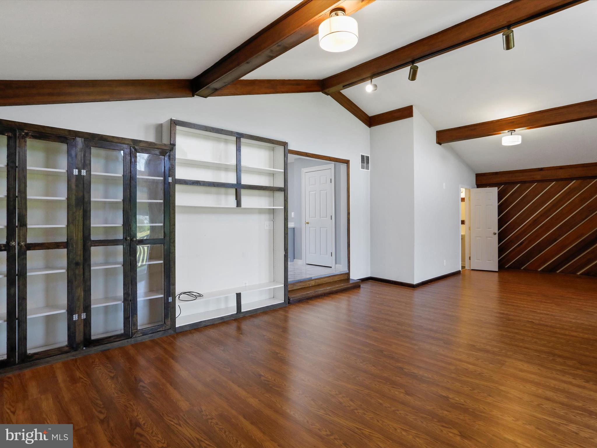 8175 Stone Bridge Road Greencastle, PA 17225 - Photo 15 of 44 a view of an empty room with wooden floor and a window