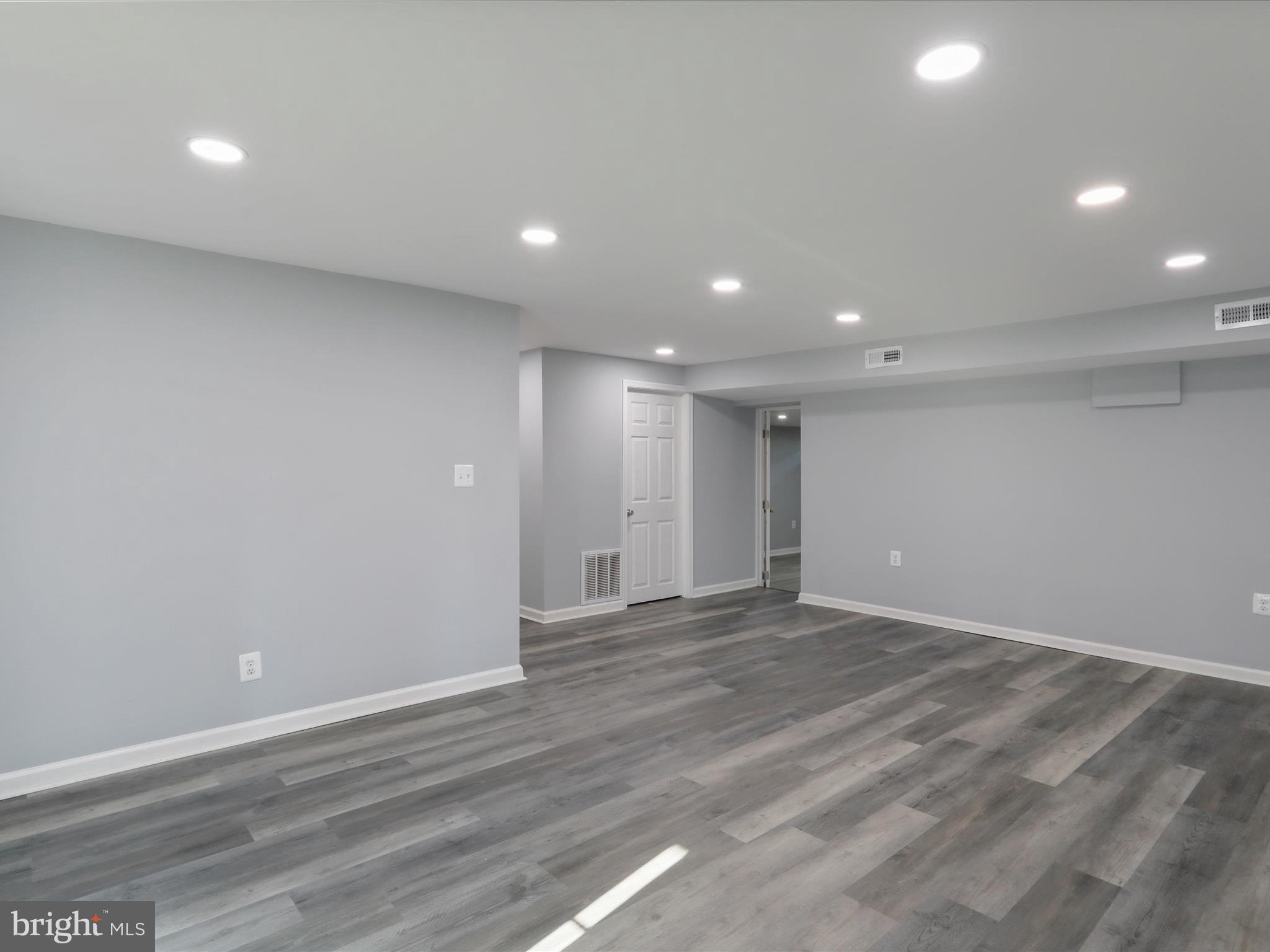 8175 Stone Bridge Road Greencastle, PA 17225 - Photo 32 of 44 an empty room with wooden floor and windows