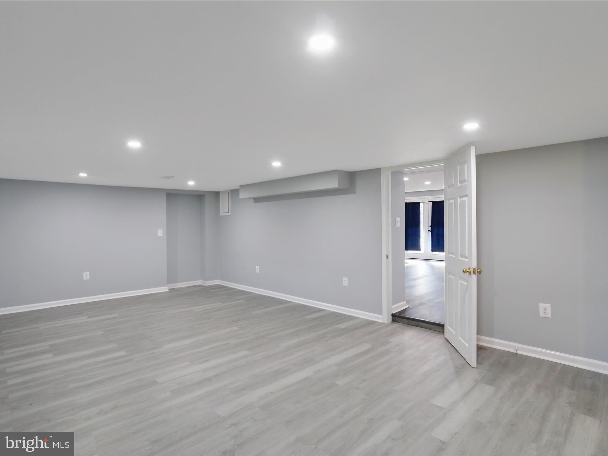 8175 Stone Bridge Road Greencastle, PA 17225 - Photo 35 of 44 an empty room with wooden floor and windows