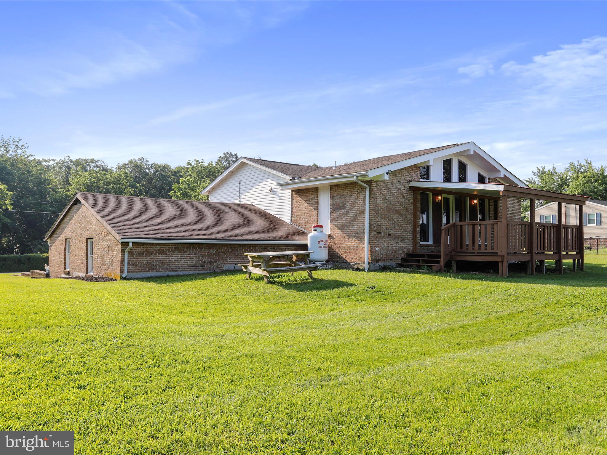 8175 Stone Bridge Road Greencastle, PA 17225 - Photo 39 of 44 a front view of a house with yard and green space