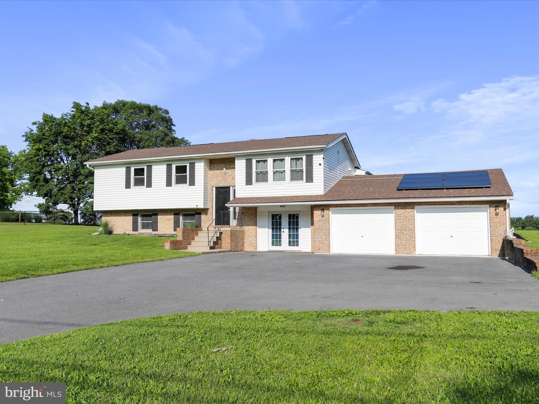 8175 Stone Bridge Road Greencastle, PA 17225 - Photo 4 of 44 a view of house with a big yard and potted plants