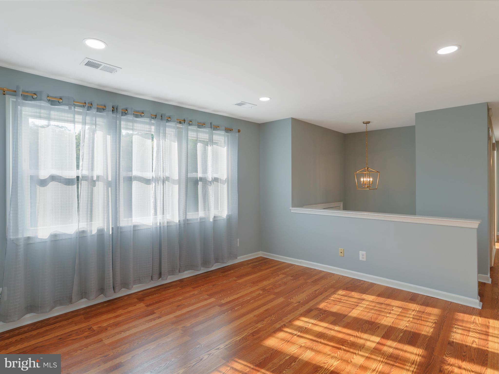 8175 Stone Bridge Road Greencastle, PA 17225 - Photo 10 of 44 a view of empty room with wooden floor and fan