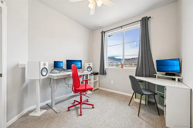 a view of workspace with furniture and window