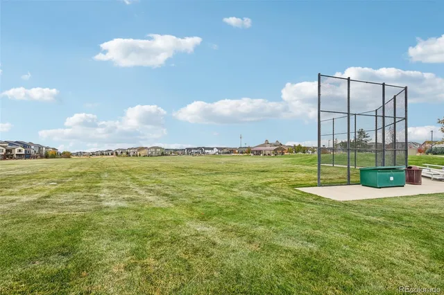 a view of a water fountain and a big yard