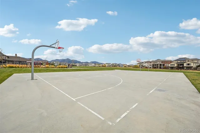 a view of a swimming pool and an outdoor seating