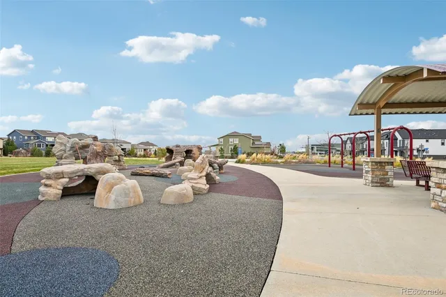 a view of swimming pool with outdoor seating and city view