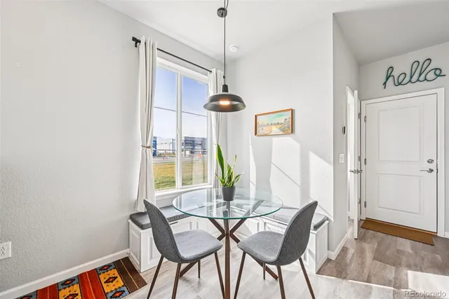 a dining room with furniture and window