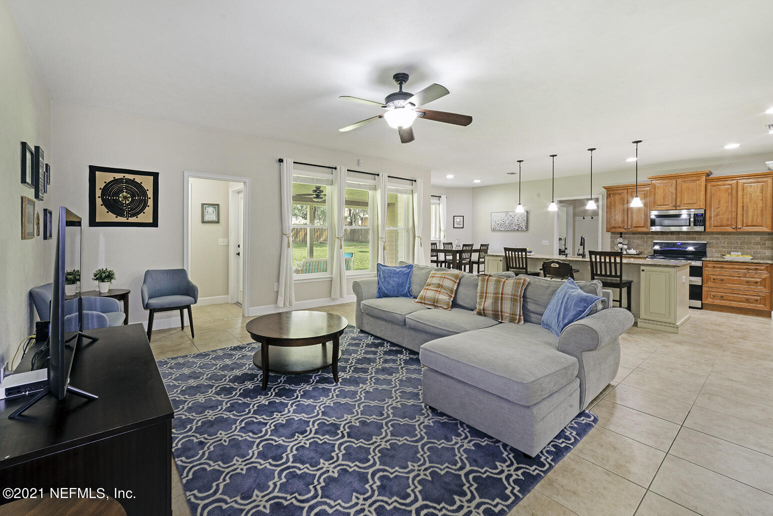 12052 Southwest 2nd Road Gainesville, FL 32607 - Photo 10 of 31 a living room with furniture and kitchen view