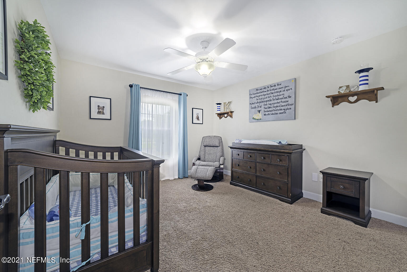 12052 Southwest 2nd Road Gainesville, FL 32607 - Photo 23 of 31 a bedroom with furniture and a window