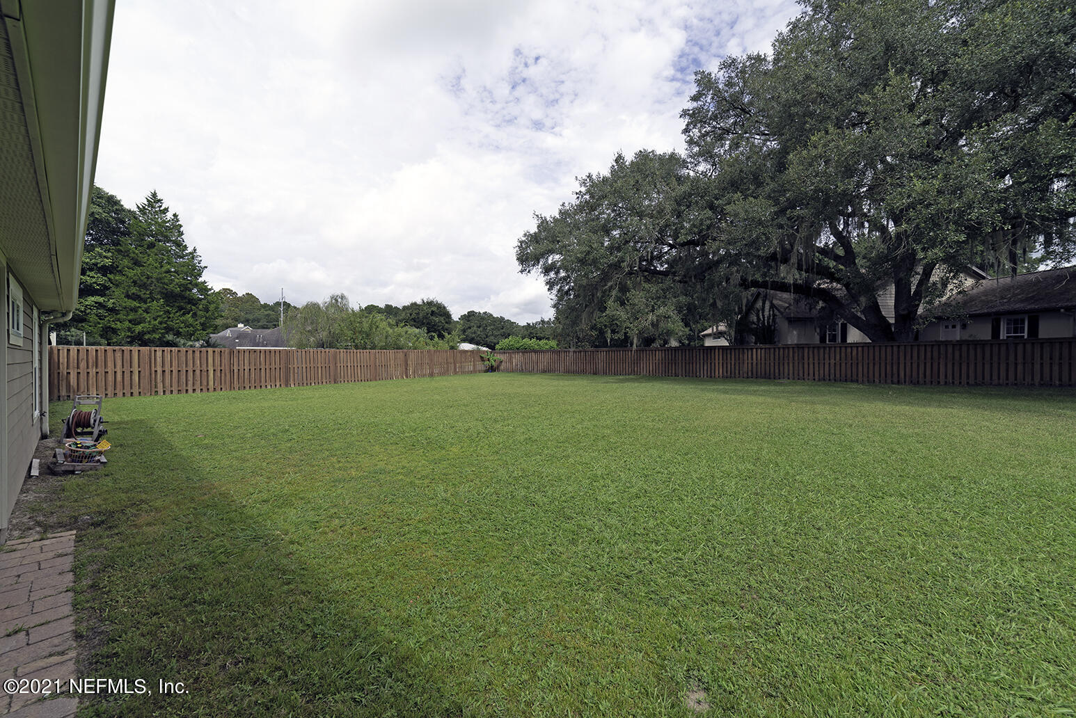 12052 Southwest 2nd Road Gainesville, FL 32607 - Photo 29 of 31 a view of yard with green space and trees in the background