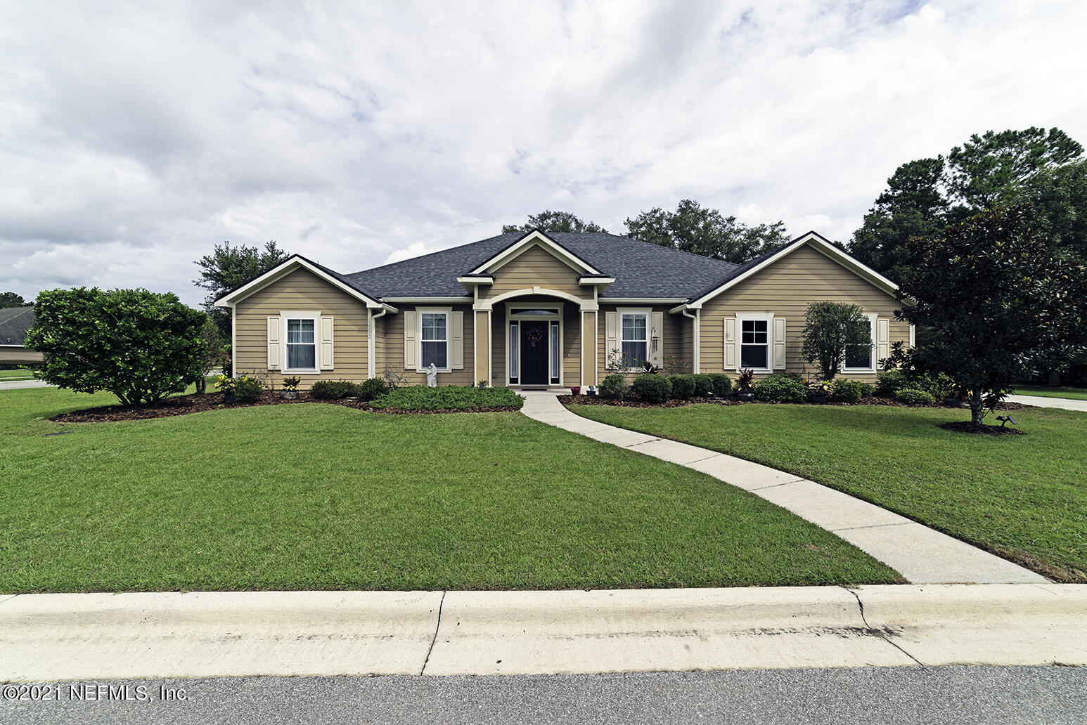 12052 Southwest 2nd Road Gainesville, FL 32607 - Photo 30 of 31 a front view of a house with a yard