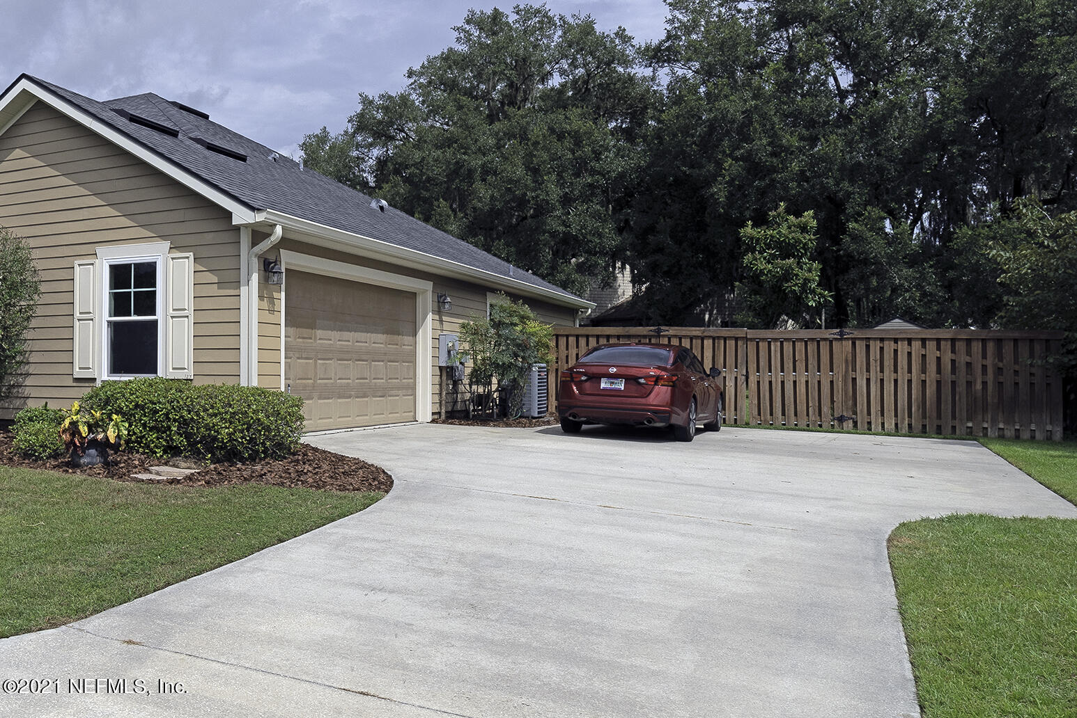 12052 Southwest 2nd Road Gainesville, FL 32607 - Photo 8 of 31 a house with trees in front of it