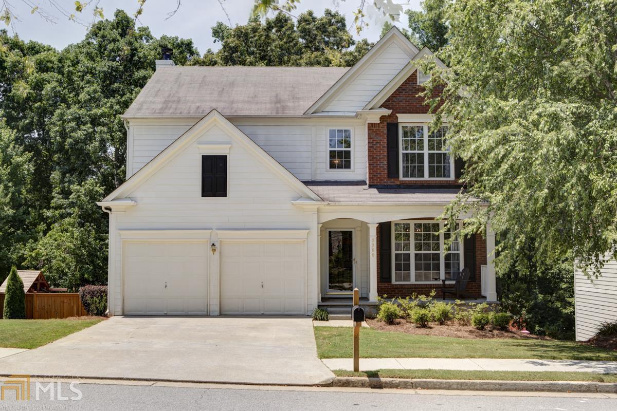 3380 Ridgefair Drive, Unit 167 Cumming, GA 30040 - Photo 1 of 1 a front view of a house with garden