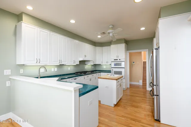 a bathroom with a double vanity sink mirror and shower