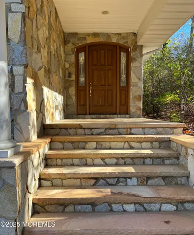a kitchen with granite countertop a sink cabinets and window