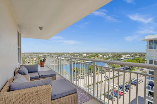 a view of roof deck with furniture