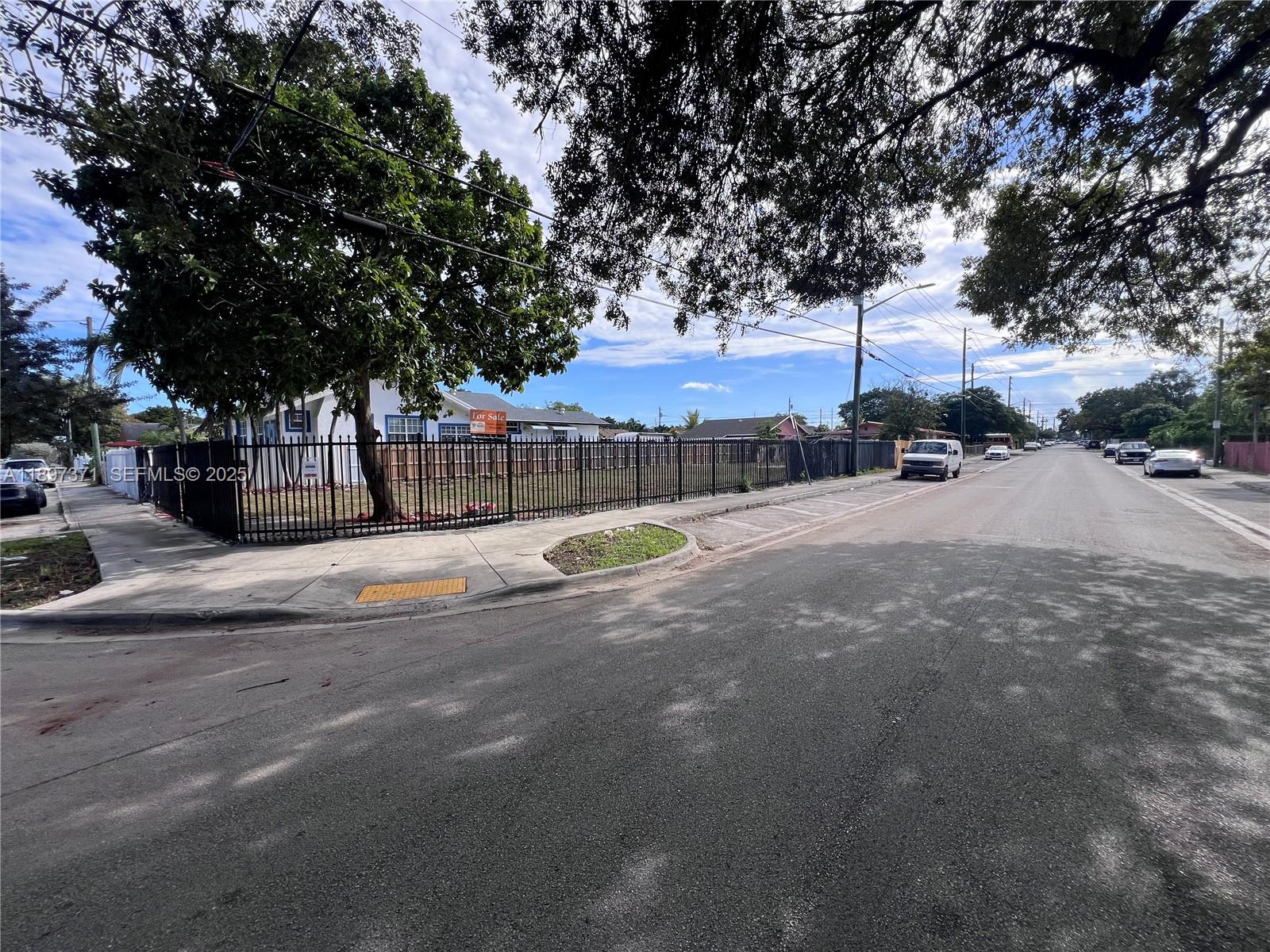 2052 Northwest 27th Street Miami, FL 33142 - Photo 11 of 14 a view of street with trees