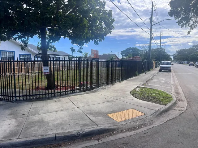a balcony with trees in front of it