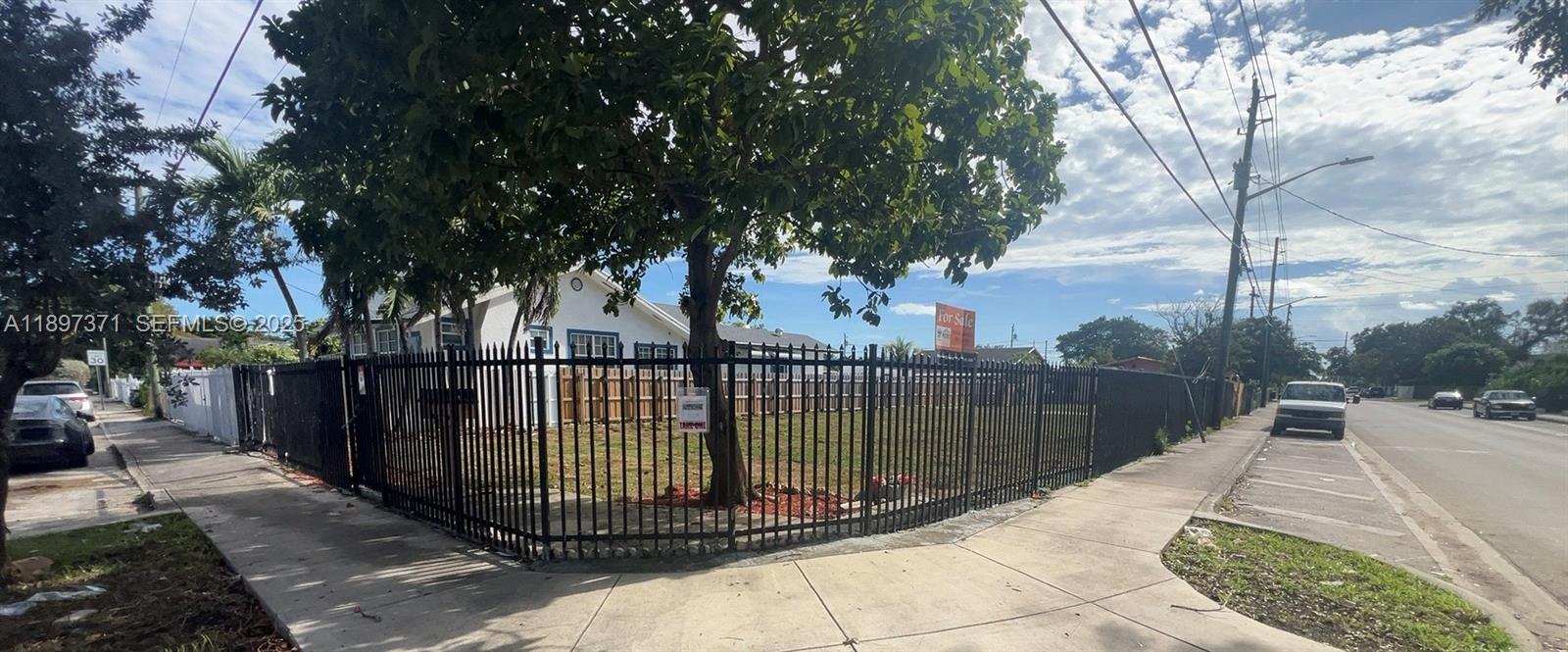 2052 Northwest 27th Street Miami, FL 33142 - Photo 13 of 14 a balcony with trees in front of it